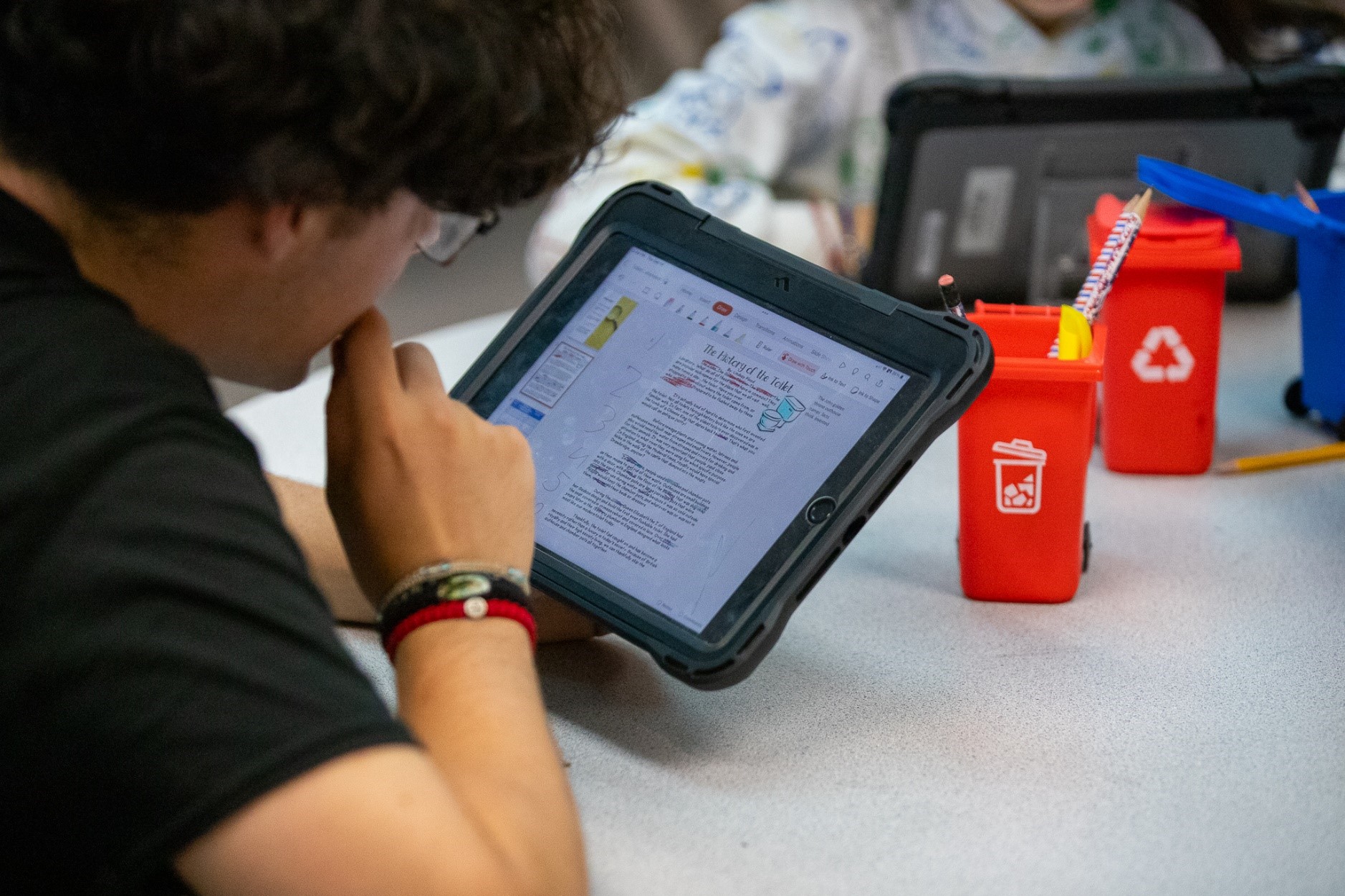 A Secrist student uses a tablet in class