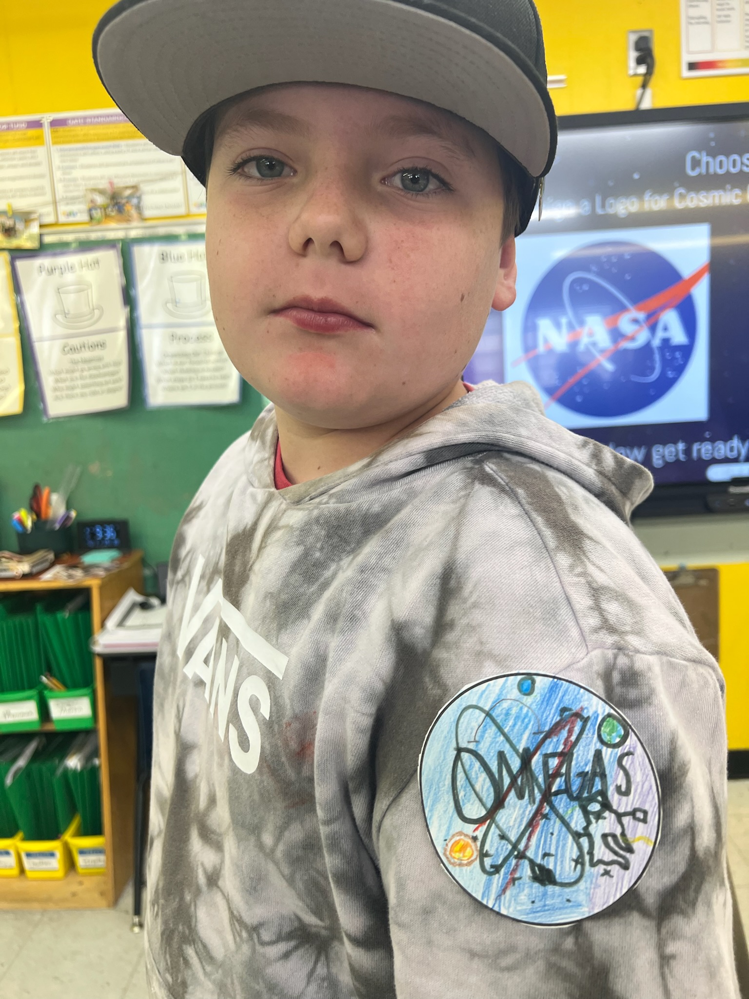 Student(s) engaged in displaying a creative NASA logo for Astronaut Academy unit