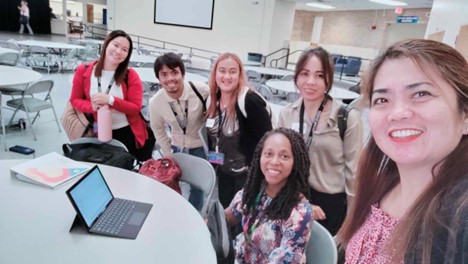 Ex Ed international teachers and Director Dr. Sabrina Salmon smile during the PD day