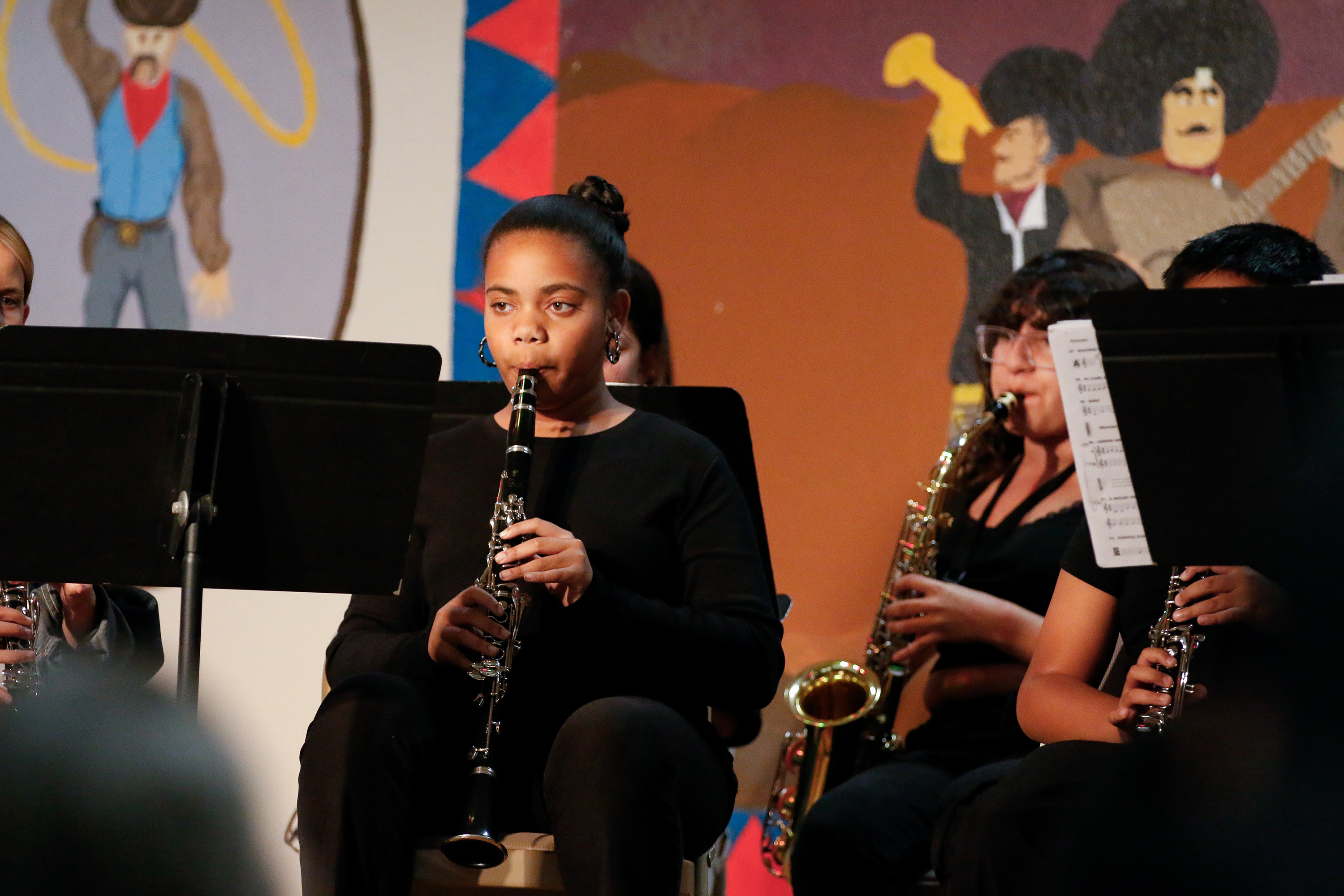 A girl plays the clarinet