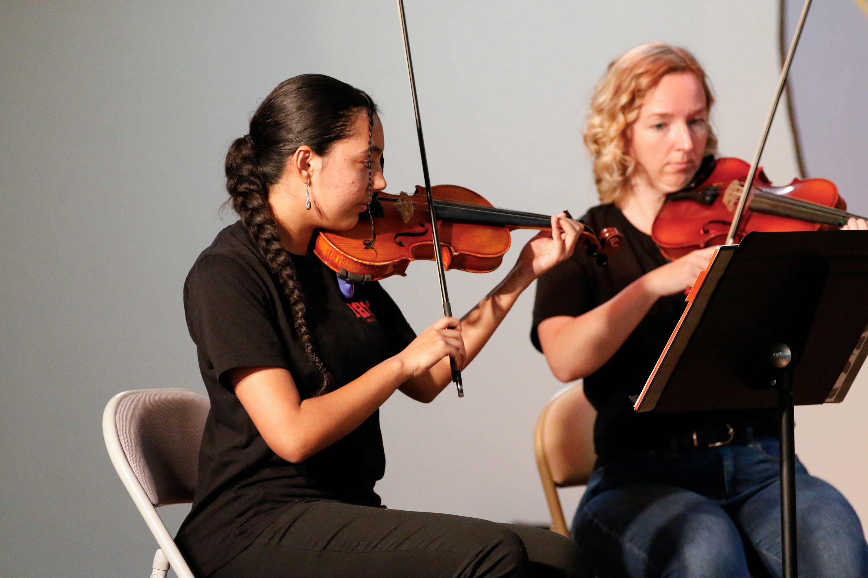 Two students play their violins