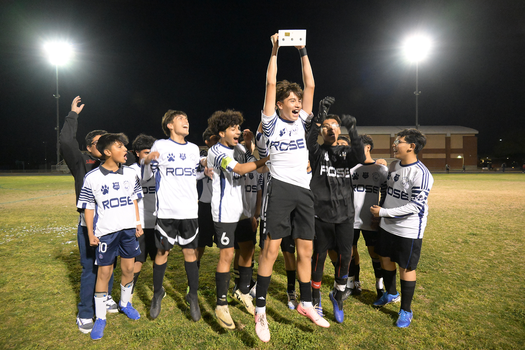 CE Rose boys soccer team celebrates with their trophy