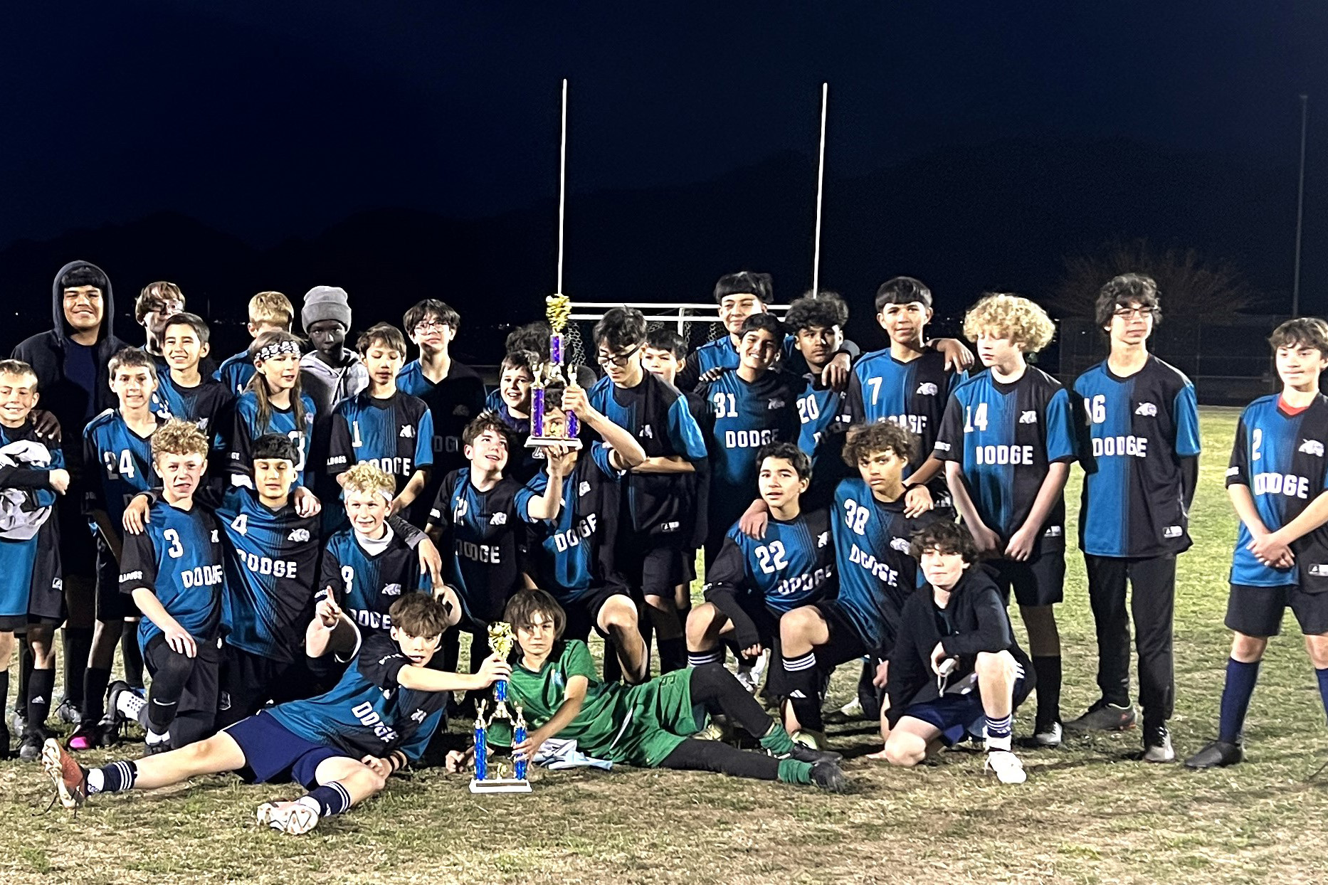 Dodge boys soccer team with their trophy