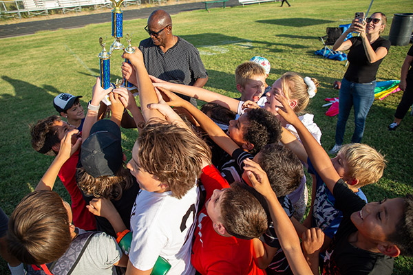 Winning Vesey Flag Football team with trophy