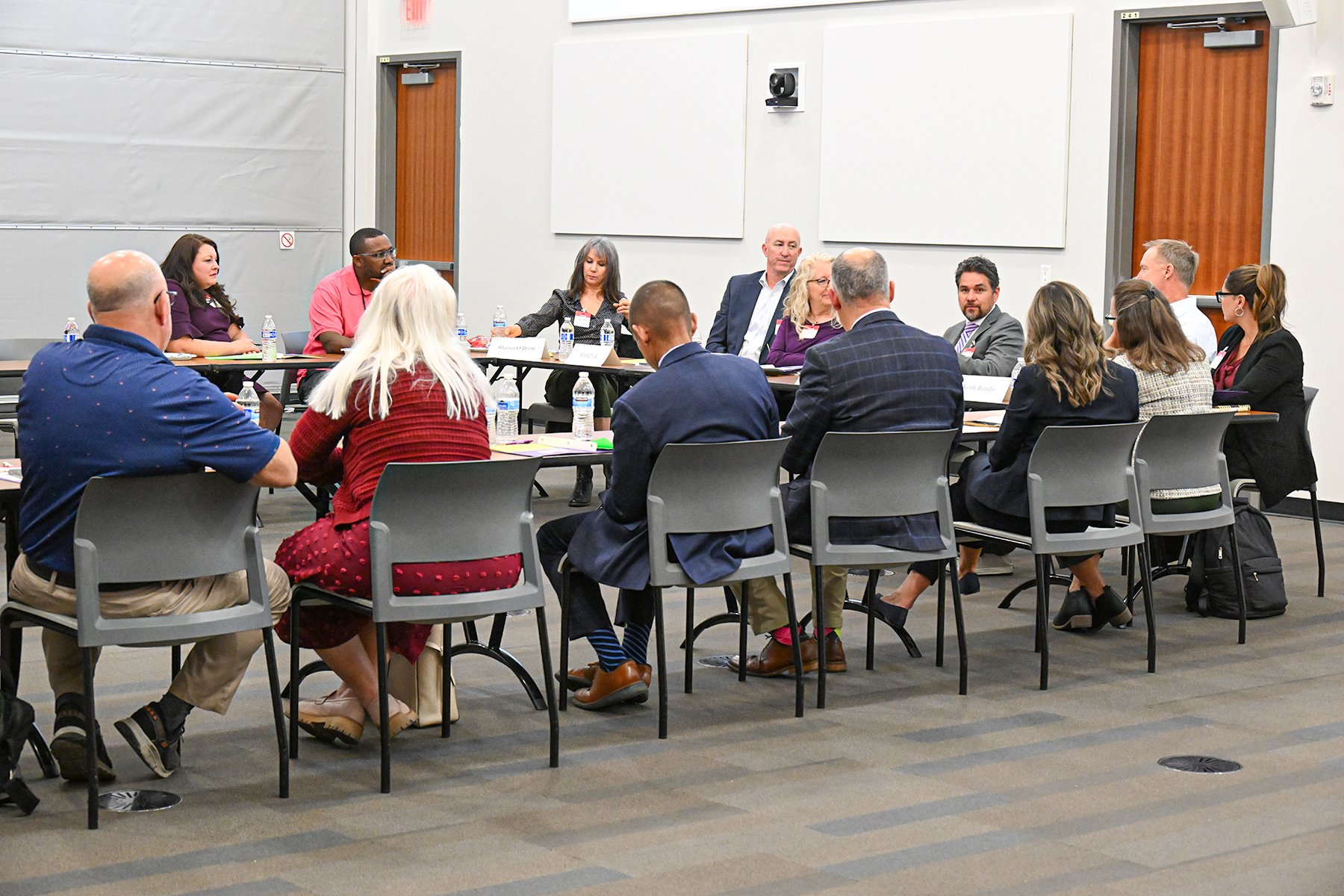 A table of local business and school leaders