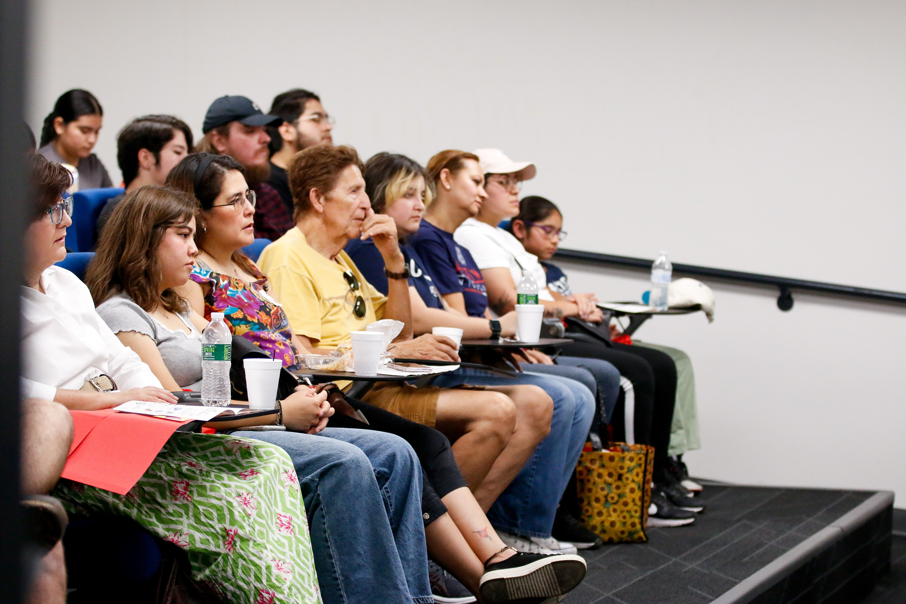 Families listen during a college session