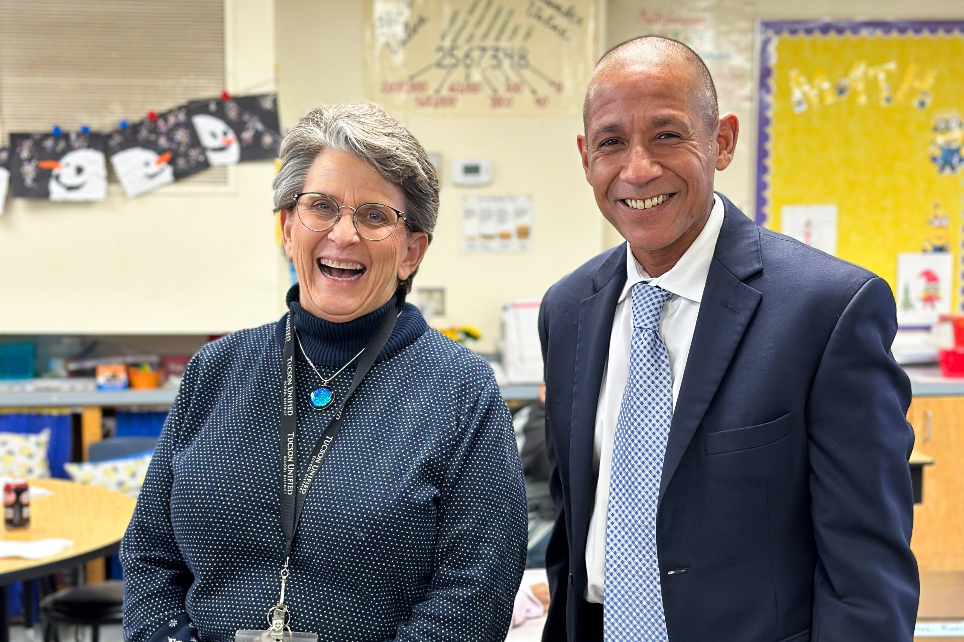 Dr. Trujillo smiles with a teacher in her classroom at Lineweaver